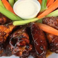 Smoked Wings · Authentic SMOKED WINGS, try them  today. Naked, buffalo, teriyaki, sweet chili, garlic parme...