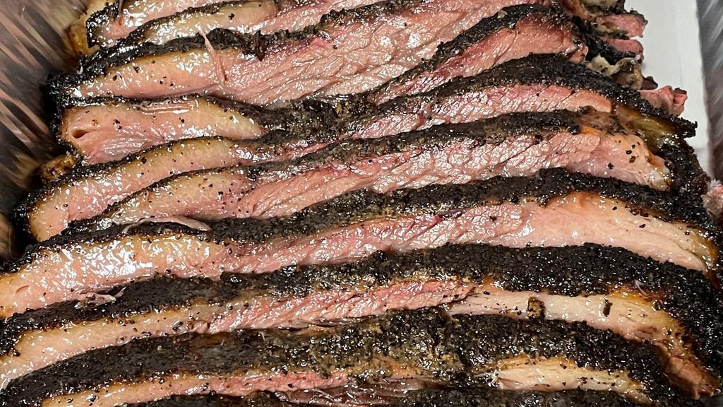 Brisket Sandwich · 7 ounces of slowly smoked  Angus brisket(12 hours) on a French roll. Choose one side. Fully smoked on oak wood.