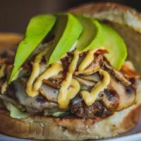 Avocado Mushroom Burger · 7 ounce fresh beef meat patty, sautéed mushrooms, Swiss cheese, fresh hash avocado topped of...