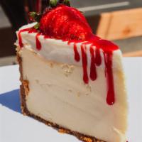 Colossal Cheese Cake · Deluxe slice of cheesecake.