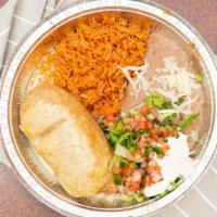 Chimichanga · Fried burrito filled with beans, cheese and choice steak, chicken or shredded beef. Served w...