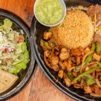 Fajitas Plate · Steak or grilled chicken. Served with rice, pinto or black beans, romaine lettuce with pepit...