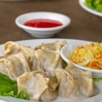 Steamed Dumplings/Buuz · 6 pcs. Beef, chicken, or vegetables.
(Usually takes 20 minutes until fully cooked)