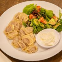 Steamed Mini Dumplings
With Sour Cream/Tsutsgiitei Bansh · Steamed mini beef dumplings with sour cream and
fresh assorted greens salad.