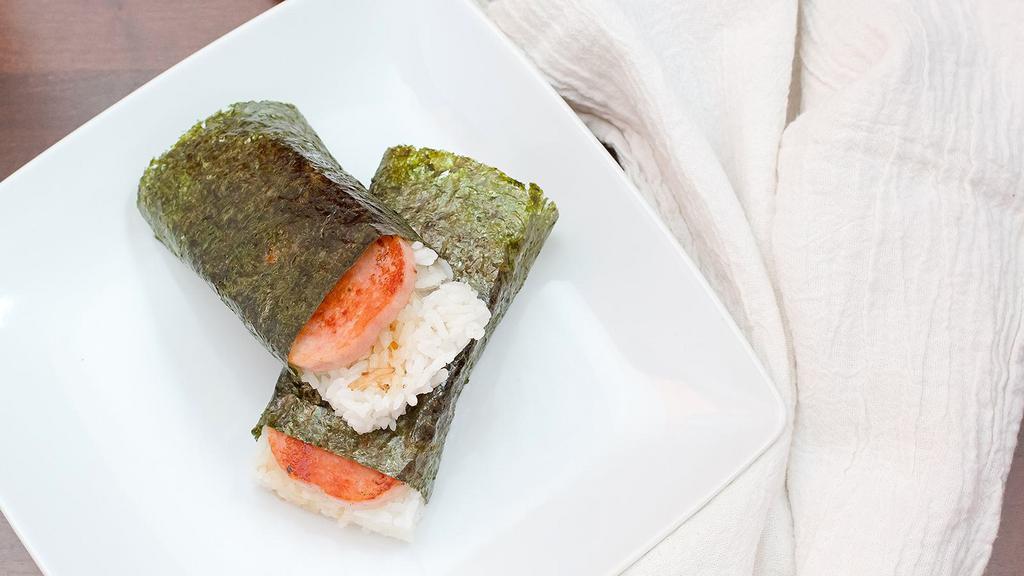 Spam Musubi (2 Pcs) · Grilled spam coated with special sauce served atop rice and wrapped together with nori.