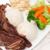 Kalbi Beef Short Ribs · Grilled, marinated kalbi beef short ribs served with; two scoops of rice, one scoop of mac s...