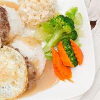 Loco Moco · Two burger patties topped with two over medium eggs covered with gravy served atop rice. Inc...