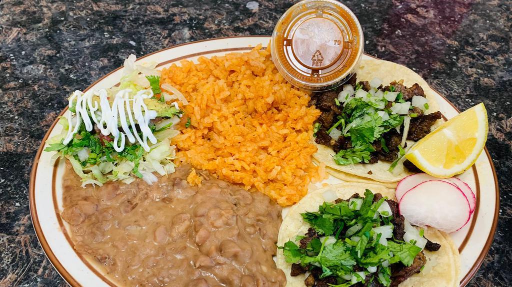 Taco Combo · 2 tacos served with a side of rice and beans!!