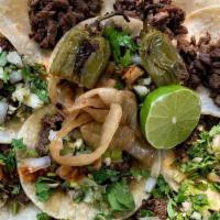 Tacos · Regular sized street tacos with veggies !!