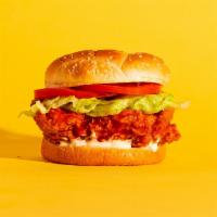 Buffalo Chicken Sandwich · Fried chicken with buffalo sauce, lettuce, tomato, and ranch on a fluffy bun.