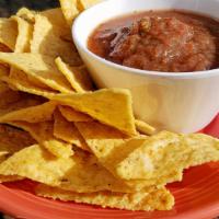 Chips & Salsa (V) · Fresh tomatoes, onion, Serrano peppers, lime juice, vinegar and spices with corn chips