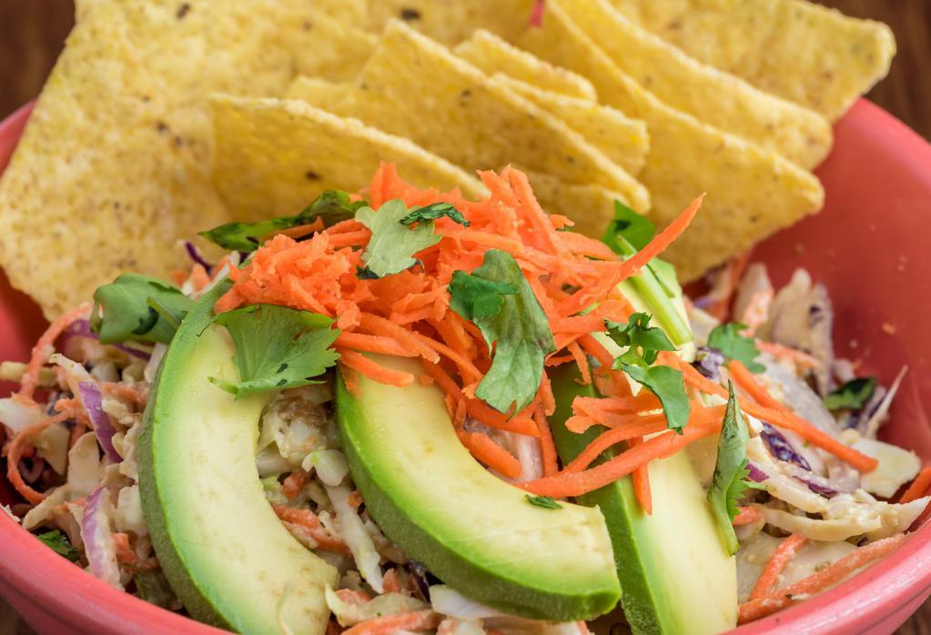 Thai (V) · Crunchy cabbage, carrot, celery, red onion, green apple tossed in Spicy Asian Almond sauce, topped with avocado & cilantro.