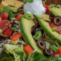 Taco Salad · Greens, avocado, tomato, black beans, vegan chorizo, salsa, choice of jack/cheddar or cashew...