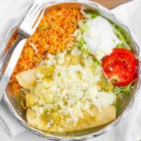 Enchiladas Verdes · Two pieces. Green tomatillo sauce topped with cheese, sour cream and avocado slices. Served ...