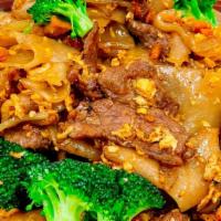 Pad See-Ew · Stir-fried flat noodle egg broccoli, carrot with your choice of protein. Add pork, chicken, ...