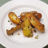 Patate · Pan fried potato with garlic and parsley.