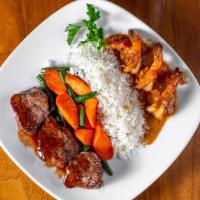 Filet Mignon & Creole Style Shrimp · Filet medallions and jumbo shrimp with glazed carrots and white rice.