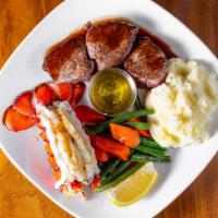 Filet Mignon & Maine Lobster · Filet medallions, cognac sauce, maine lobster tail, green beans provencal, and garlic whippe...
