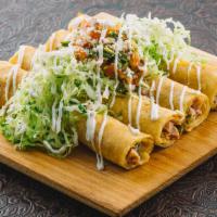 Rolled Chicken Taquitos · Mesquite chicken, poblano chillies and jalapeno jack cheese wrapped in 4 crispy corn tortill...