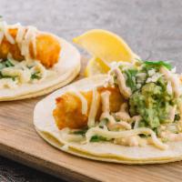 Fish Taco Especial · Lightly fried mahi filets with fresh guacamole, cilantro, red onion, queso blanco and chipot...