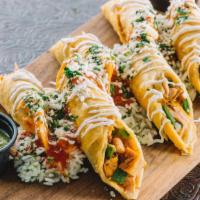 Crispy Chicken Flautas · Mesquite grilled chicken, red peppes, grilled corn and queso blanco wrapped up in lightly cr...
