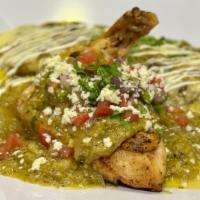 Pollo Verde Y Enchilada · Pan seared bone-in chicken breast with verde cream sauce paired with an enchilada filled wit...