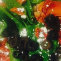 Spinach Salad - Large · A bed of fresh spinach topped with olives, sun-dried tomatoes, cucumbers and feta cheese. He...