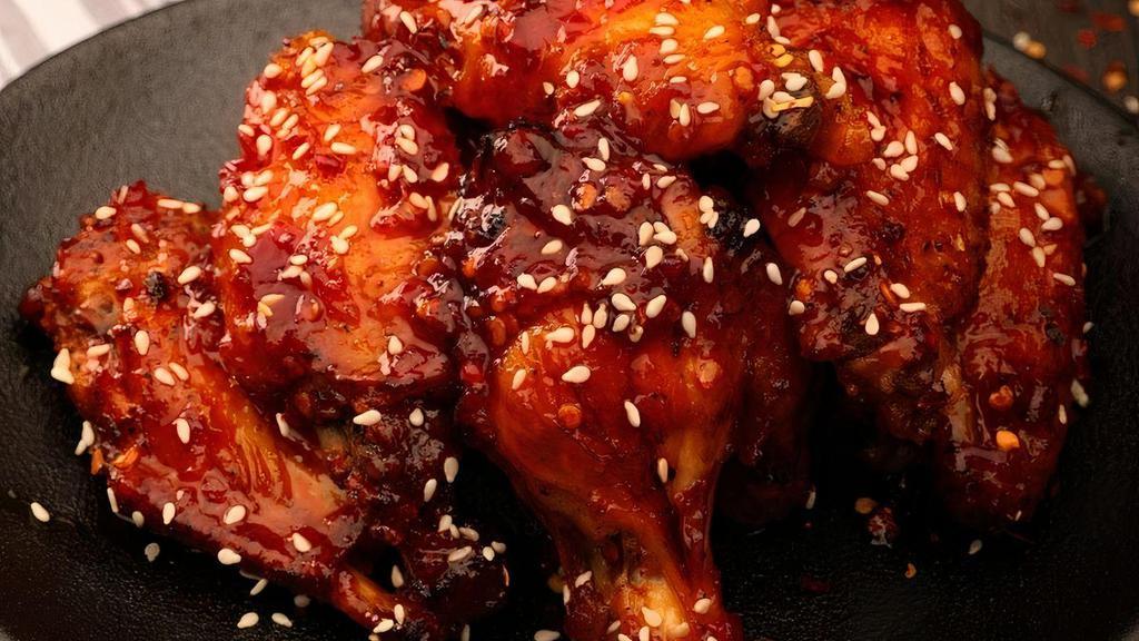 Sweet & Spicy Calabrian Chile Wings · Seven wings tossed in our house made Sweet & Spicy Calabrian Chile sauce and sesame seeds. Served with your choice of blue cheese or ranch dressing.