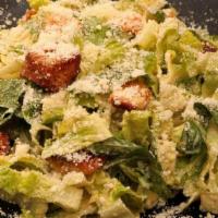 Caesar Salad · Parmigiano, toasted croutons with secret house recipe dressing on the side.