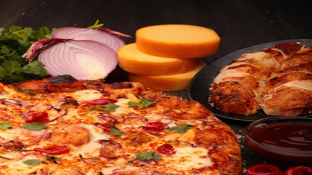 Bbq Chicken Pizza · Roasted chicken, BBQ sauce, smoked mozzarella, peppadews, red onions, cilantro.