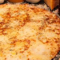 Quattro Formaggi Pizza · Bianca with smoked mozzarella, gorgonzola, fontina. Finished with wildflower honey.