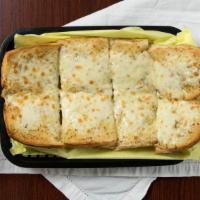 Garlic Bread · Buttery garlic spread served on 10” Italian roll bread.