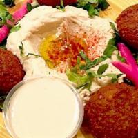Falafel With Hummus · 4 pieces of Falafel served with hummus and tahini sauce.