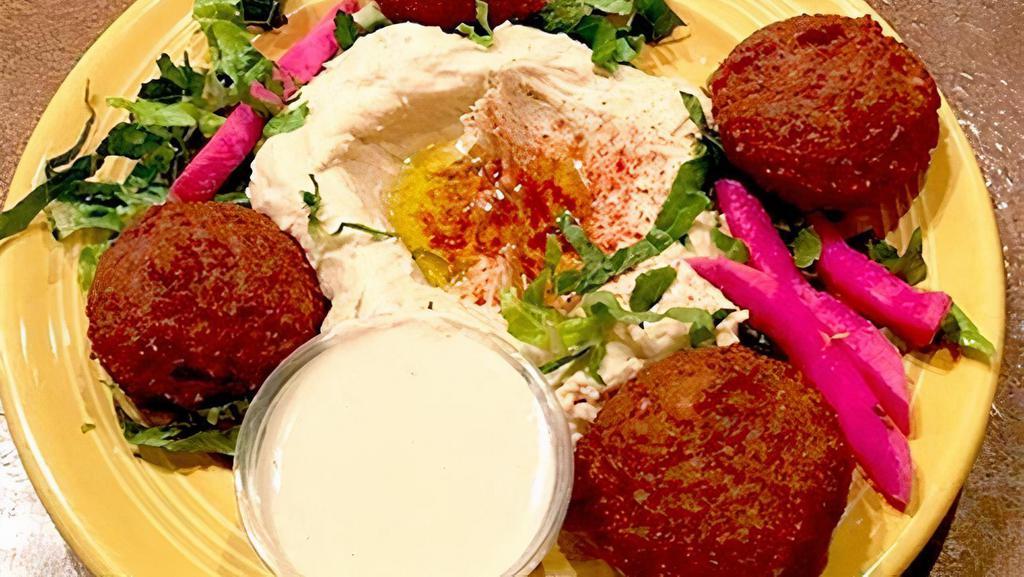 Falafel With Hummus · 4 pieces of Falafel served with hummus and tahini sauce.