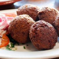Falafel Appetizer · Fried patties of chickpeas with herbs and spices.