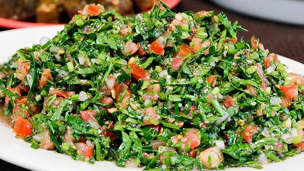 Tabouleh Salad · Parsley, tomato, onion, burgul (cracked wheat), lemon juice and olive oil.