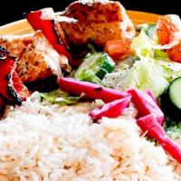 Wild Salmon Kebab Plate · Wild Alaskan Salmon kebab served with rice, tahini, and Lebanese salad.