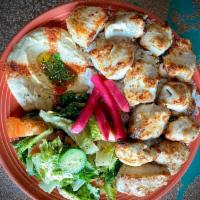 Chicken Kebab Combo · 3 skewers of chicken kebab. Served with hummus, rice and lebanese salad. Naturally raised wi...