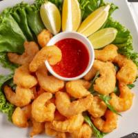 Beer Battered Shrimp · Large shrimp dipped in our special beer batter and served with cocktail sauce
