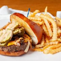 Rookies Burger · Grilled 1/2 lb. burger smothered in grilled onions, American cheese, pickles and a “secret s...
