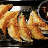 31 Kieow Za · Pan-fried chicken & vegetable dumplings