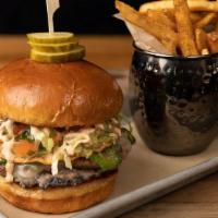 Tostada Burger · house-seasoned, made to order Louie's custom blend burger patty, mashed black beans, grilled...
