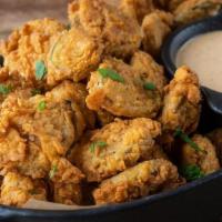 Hand Breaded Fried Pickles · house-made frickin’ spicy ranch