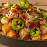 Loaded Tots · queso, jalapeños, applewood smoked bacon, scallions