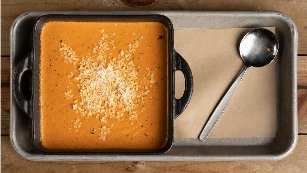 Creamy Tomato Basil Soup · served with parmesan cheese.