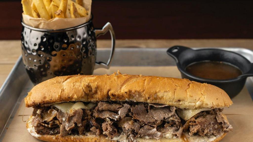 Cheese Steak Dip · shaved sirloin steak, provolone, caramelized onions, creamy herb cheese, toasted hoagie roll, French onion au jus