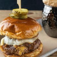 Gastroburger · Louie’s custom burger blend, cooked medium well,   shaved sirloin, caramelized onions, queso...