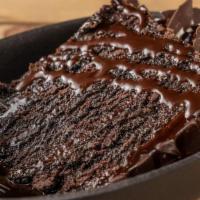 Decadent Chocolate Cake · Chocolate cake, filled with rich milk chocolate ganache, chocolate sauce, whipped cream, ama...
