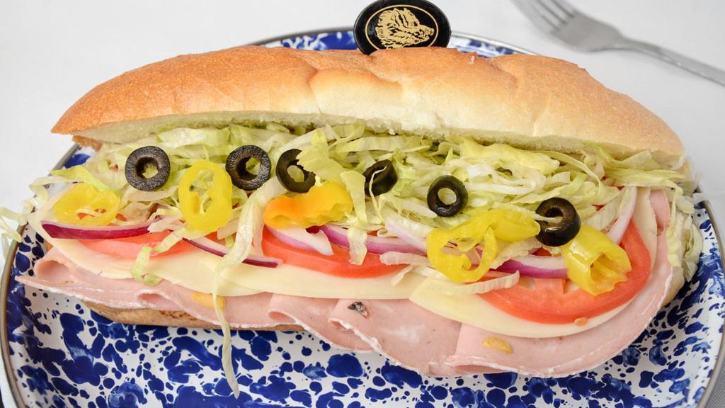 Mortadella Sub · Mortadella, provolone cheese, black olives, sweet roasted peppers, banana peppers, lettuce, tomato, onion, mayo, mustard, and deli dressing.