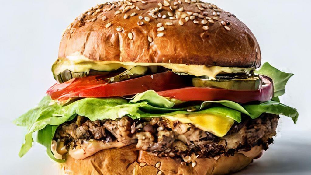 Ultimate Veggie Burger · Veggie Pattie, Cheddar Cheese, Lettuce, Tomato, Onion, Pickles, Thousand Island Dressing